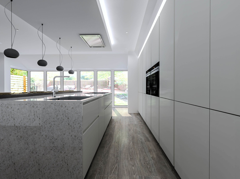 Large modern single-wall open plan kitchen in London with a single-bowl sink, flat-panel cabinets, white cabinets, quartzite benchtops, black appliances, light hardwood floors, with island and grey floor.