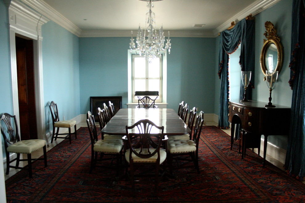 Mid-sized traditional separate dining room in Boise with blue walls, carpet, no fireplace and red floor.