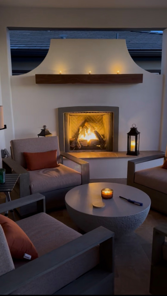 Photo of a large rustic shade backyard stone landscaping in Phoenix with a fireplace.