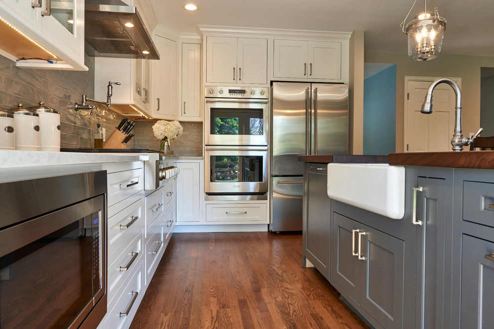 Example of a transitional kitchen design in Denver