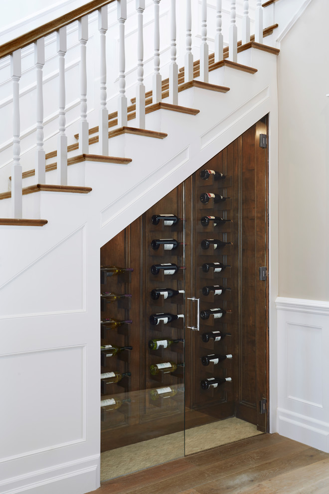Mid-sized transitional wine cellar in Los Angeles with porcelain floors, diamond bins and beige floor.