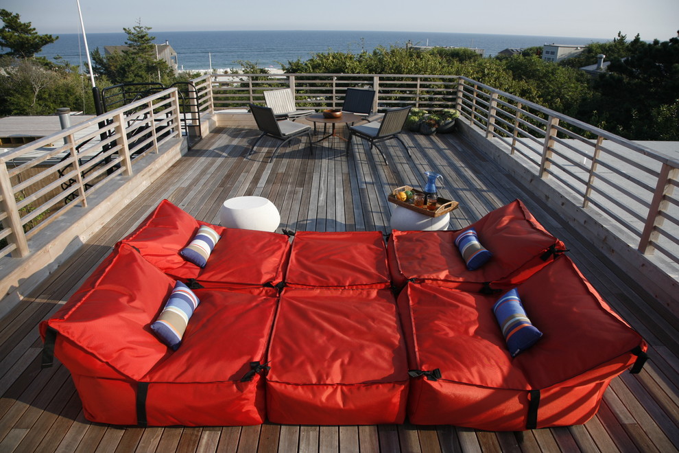 This is an example of a beach style rooftop and rooftop deck in New York.