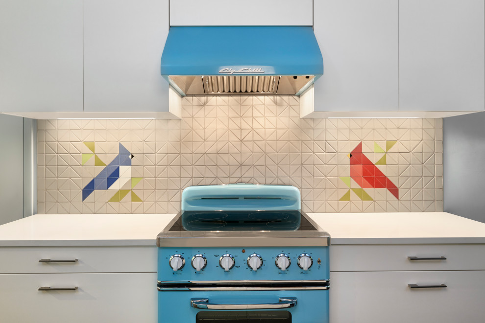 Retro kitchen in Philadelphia with a submerged sink, flat-panel cabinets, brown cabinets, engineered stone countertops, multi-coloured splashback, ceramic splashback, coloured appliances, slate flooring, an island, grey floors, white worktops and exposed beams.