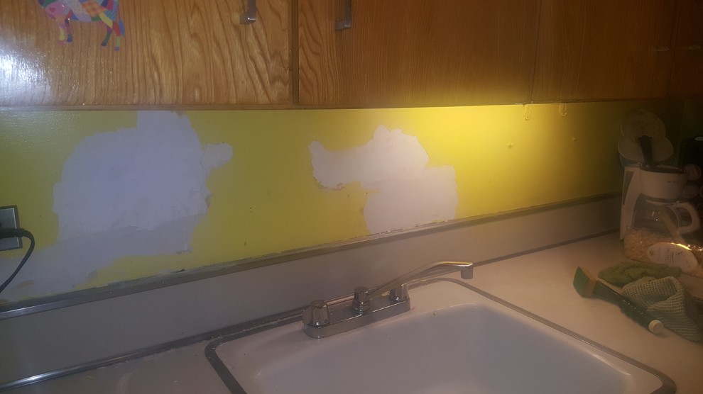 Applying peel and stick backsplash to an uneven surface plaster wall