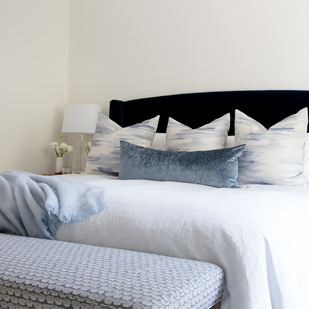 Example of a mid-sized transitional master dark wood floor and brown floor bedroom design in Toronto with white walls