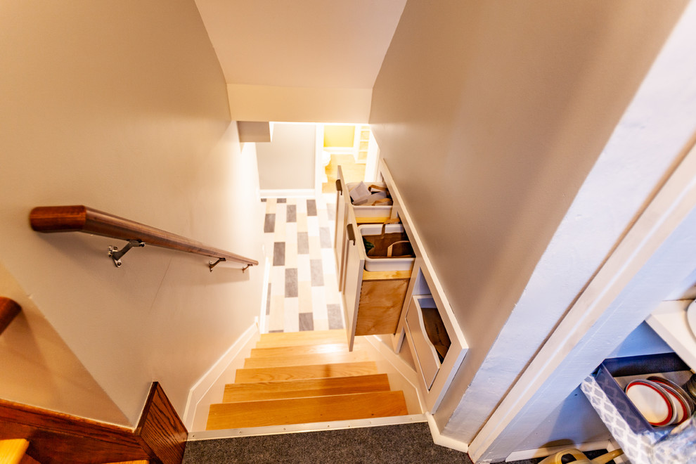 Inspiration for a transitional wood straight staircase in Minneapolis with wood risers and wood railing.