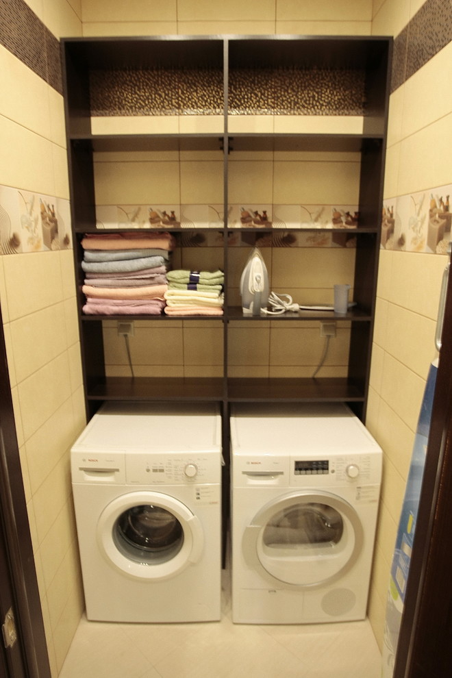 Inspiration for a small contemporary single-wall dedicated laundry room in Moscow with open cabinets, beige cabinets, laminate benchtops, beige walls, ceramic floors, a side-by-side washer and dryer, beige floor and brown benchtop.