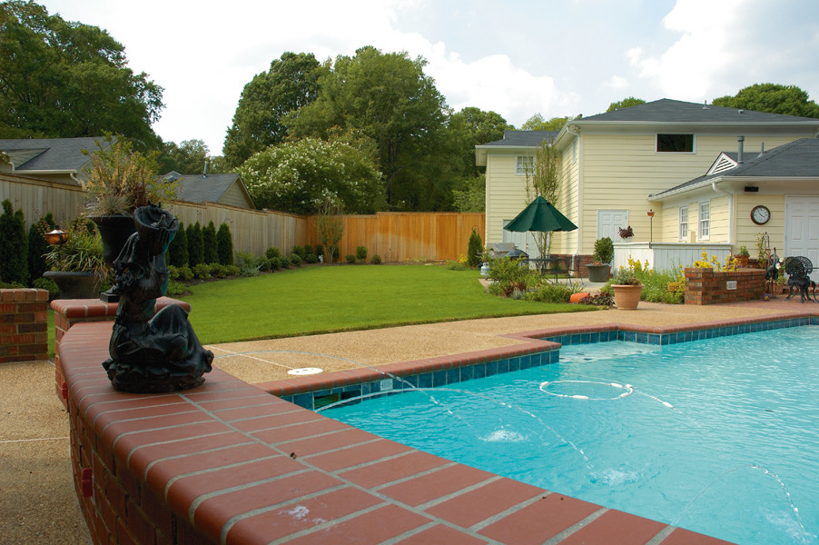 Pool fountain - large backyard brick and rectangular pool fountain idea
