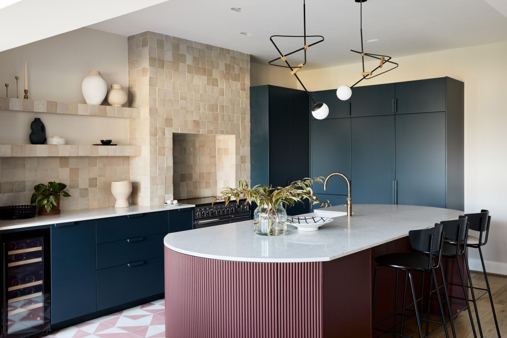 Large contemporary l-shaped kitchen in London with cement tiles and pink floor.