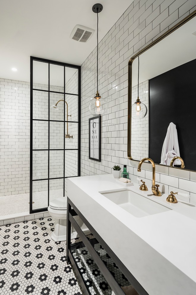 Photo of a mid-sized transitional master bathroom in Phoenix with open cabinets, black cabinets, an open shower, a two-piece toilet, black and white tile, subway tile, black walls, mosaic tile floors, an undermount sink and engineered quartz benchtops.