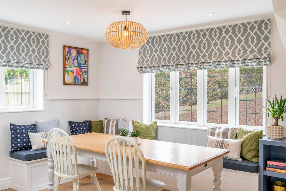 Design ideas for a transitional dining room in Surrey.
