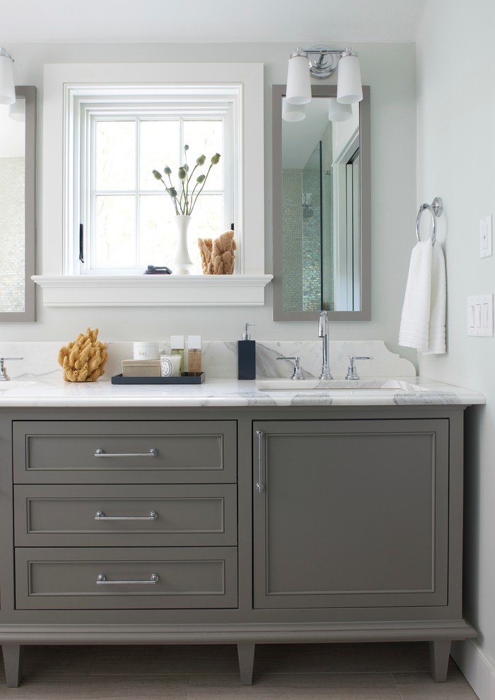 This is an example of a beach style bathroom in Boston with marble benchtops, grey cabinets, shaker cabinets, grey walls and a drop-in sink.
