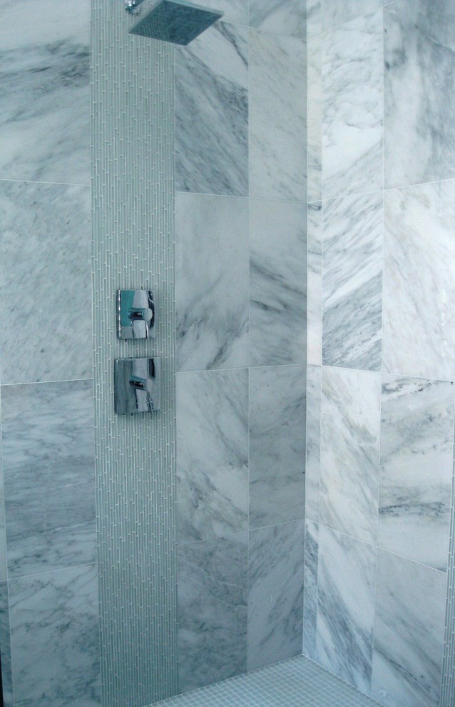 Photo of a contemporary bathroom in Miami with white tile, stone tile, a double shower and mosaic tile floors.