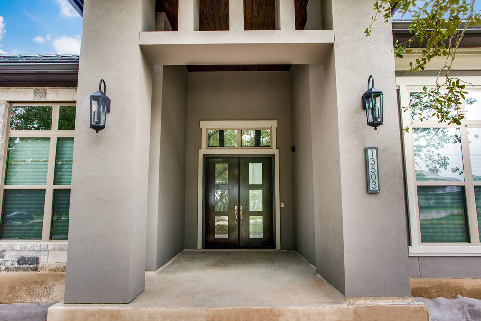 Design ideas for a transitional front door in Austin with grey walls, a double front door and a black front door.