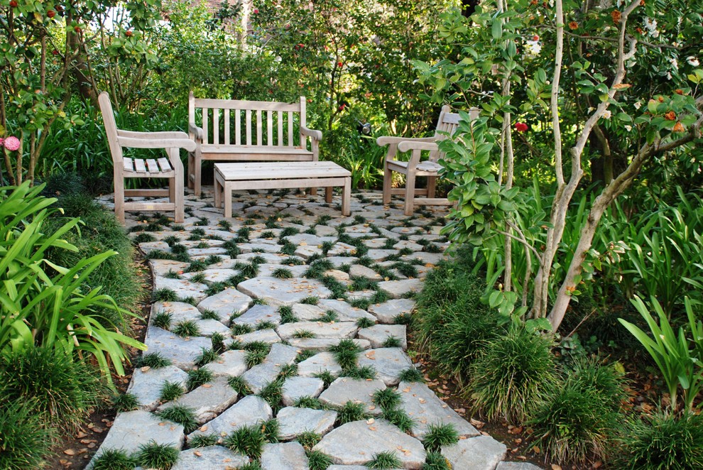Photo of a traditional patio in Los Angeles with natural stone pavers and no cover.