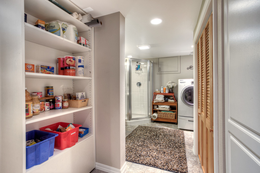 Traditional laundry room in Seattle with beige walls and linoleum floors.