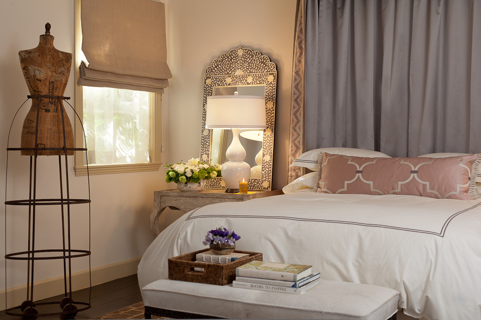 Inspiration for a mediterranean bedroom in San Francisco with white walls and dark hardwood floors.