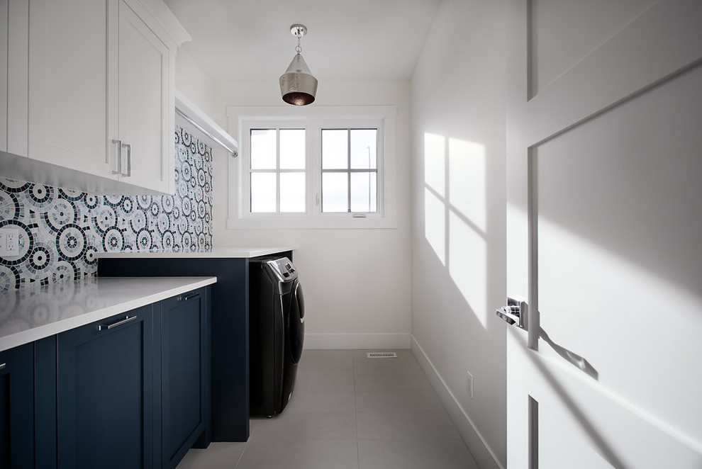 Example of a transitional laundry room design in Calgary