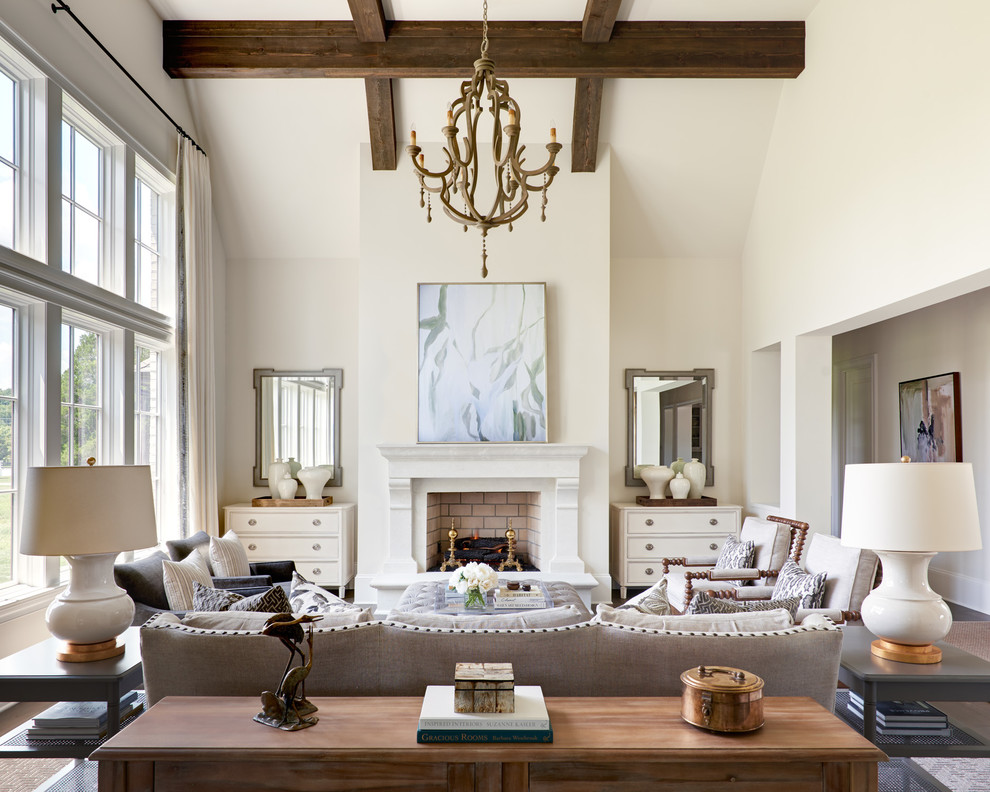 Inspiration for a traditional formal living room in Charlotte with white walls and a standard fireplace.