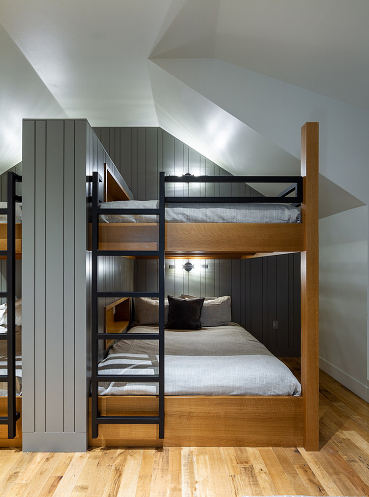 Coburg Farmhouse Remodel - Inspiration for a bedroom gender-neutral light wood floor, brown floor, vaulted ceiling and wall paneling kids' bedroom remodel with gray walls