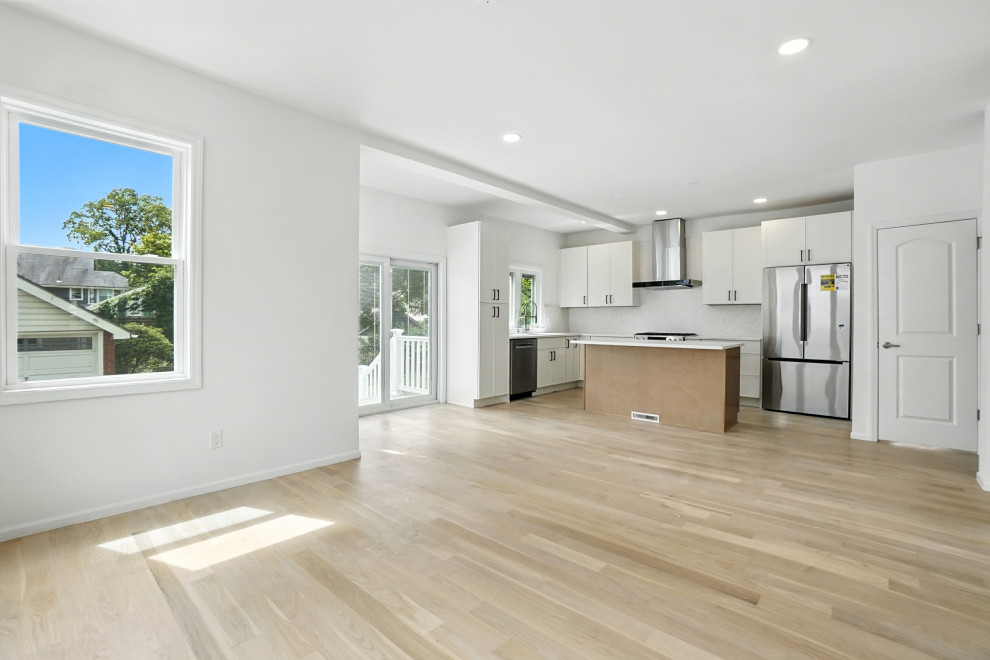 White Kitchen with Wood Island and Steel Hood