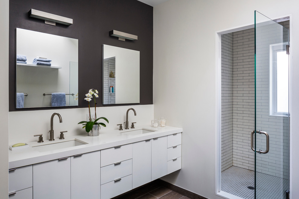 Inspiration for a contemporary master bathroom in New York with flat-panel cabinets, white cabinets, an alcove shower, white tile and white walls.