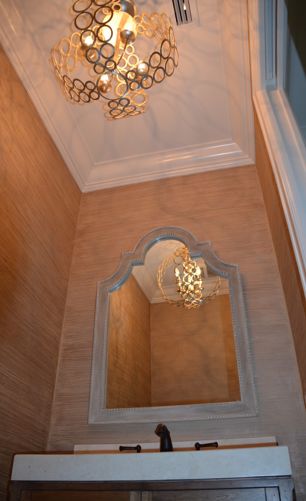 Small transitional dark wood floor bathroom photo in DC Metro with an integrated sink, furniture-like cabinets, medium tone wood cabinets, marble countertops, a one-piece toilet and beige walls