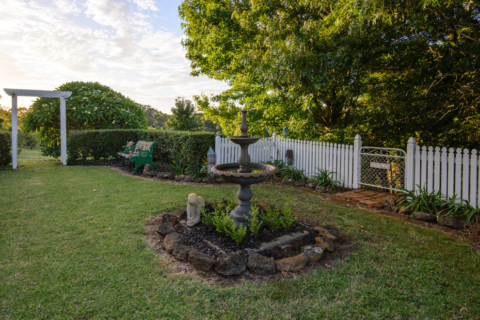 Design ideas for a traditional garden in Brisbane.