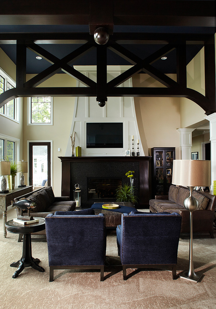 Inspiration for a traditional living room in Grand Rapids with beige walls and carpet.