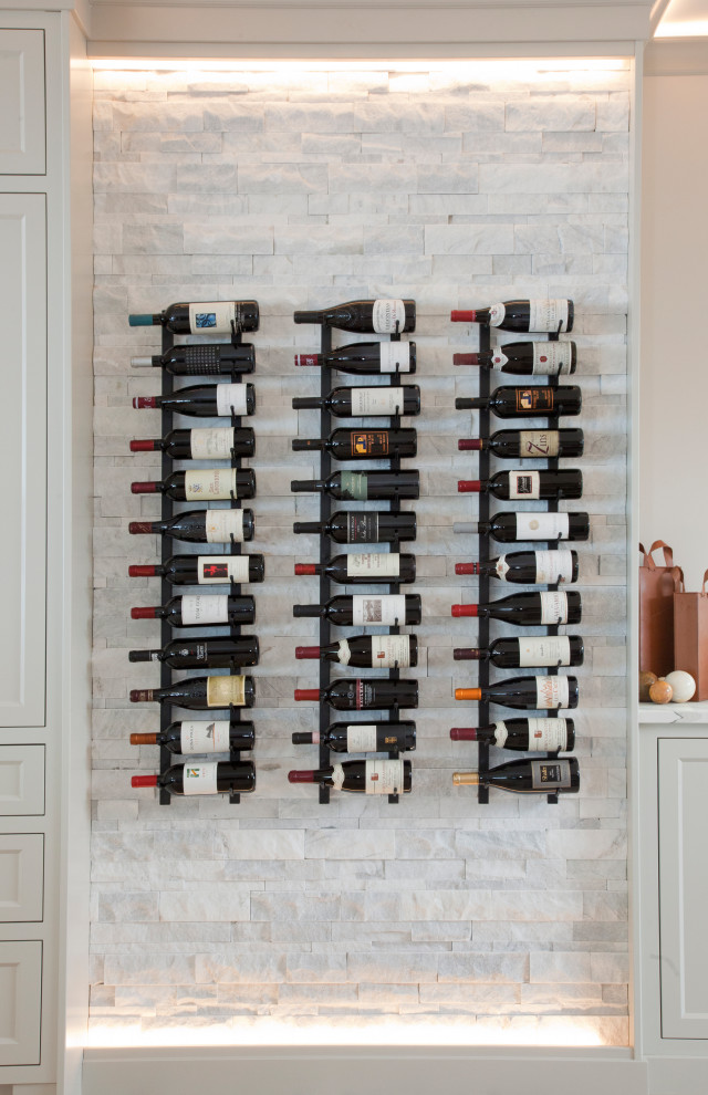 Inspiration for a mid-sized transitional wine cellar in Vancouver with marble floors and storage racks.
