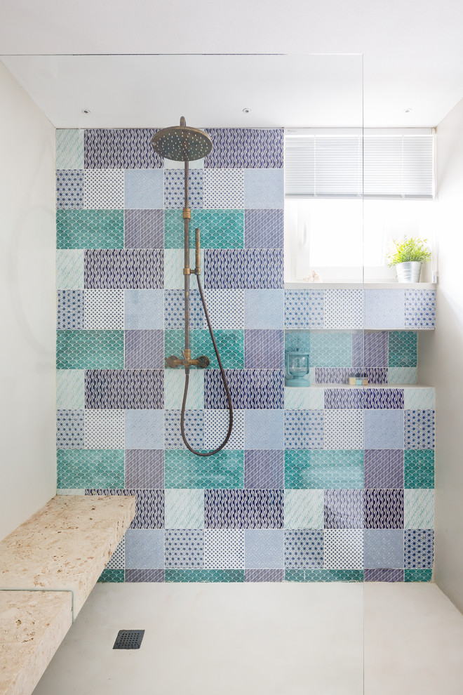 Beach style bathroom in Rome with multi-coloured tile, ceramic tile, a curbless shower, beige walls, beige floor and an open shower.