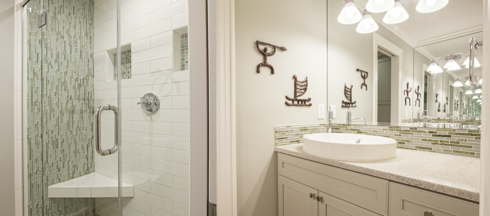 Example of a transitional green tile and glass tile ceramic tile, beige floor and double-sink bathroom design in Other with recessed-panel cabinets, green cabinets, a two-piece toilet, a vessel sink, concrete countertops, a hinged shower door, beige countertops and a built-in vanity