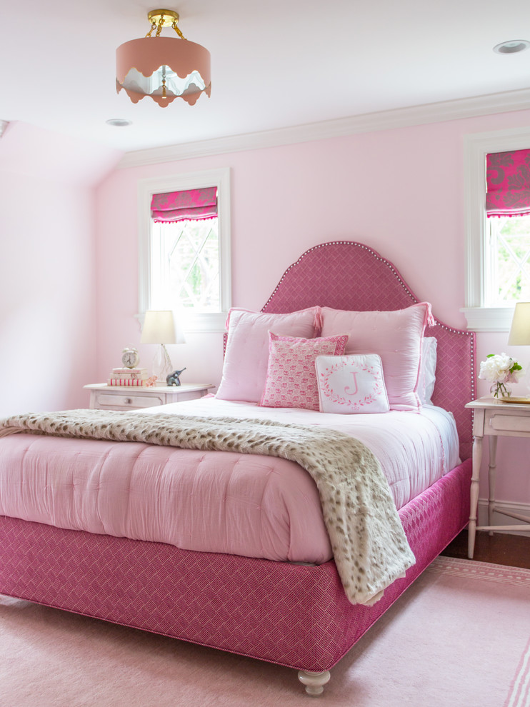 This is an example of a mid-sized traditional bedroom in Boston with pink walls.