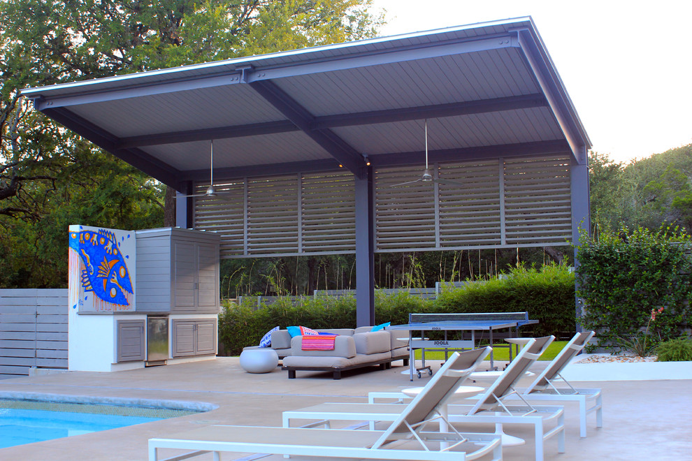 Inspiration for a large modern backyard patio in Austin with concrete slab and a gazebo/cabana.