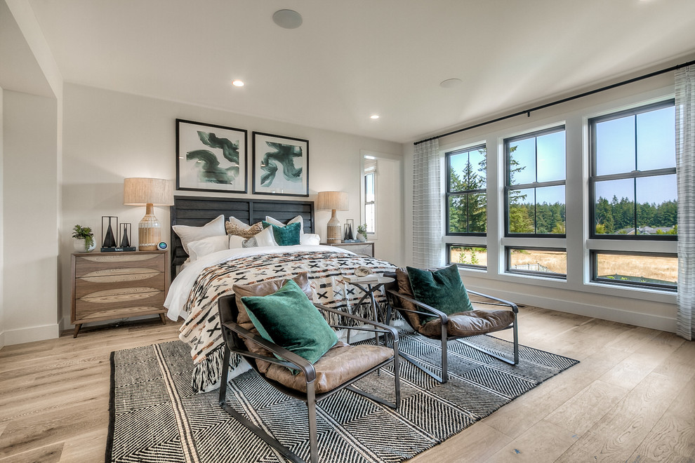 Bedroom - transitional master light wood floor bedroom idea in Seattle with white walls