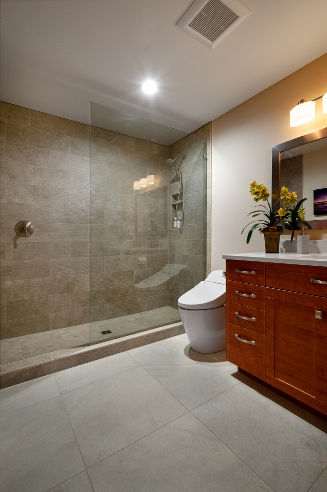 This is an example of a mid-sized contemporary 3/4 bathroom in Seattle with shaker cabinets, medium wood cabinets, a two-piece toilet, porcelain floors, engineered quartz benchtops, white benchtops, a niche, a single vanity, a built-in vanity, an alcove shower, brown tile, porcelain tile, beige walls, an undermount sink, beige floor and an open shower.