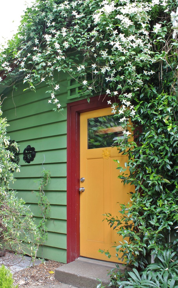 Eclectic front door with a single front door and a yellow front door.