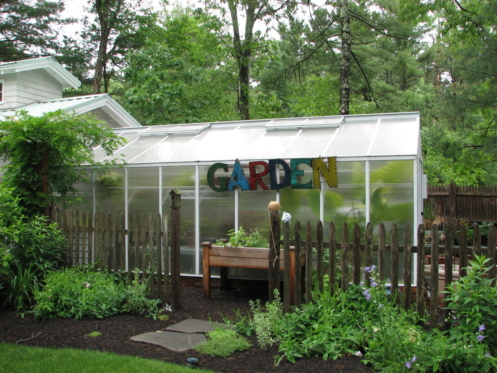 Photo of a mid-sized traditional detached greenhouse in Boston.