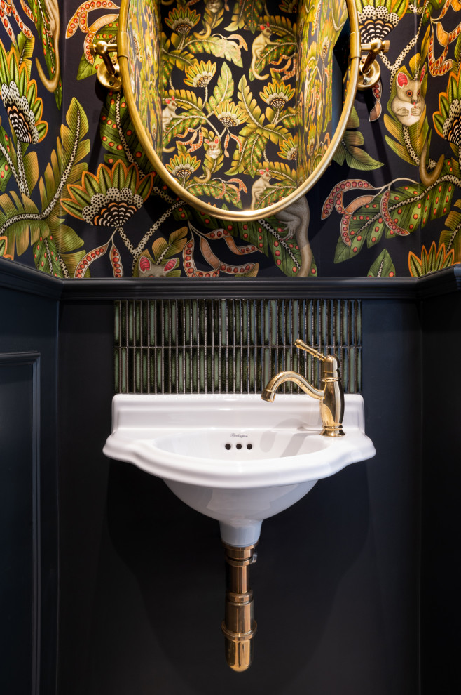 Small cloakroom in London with a wall mounted toilet, green tiles, ceramic tiles, multi-coloured walls, porcelain flooring, a wall-mounted sink, beige floors, a dado rail and wallpapered walls.