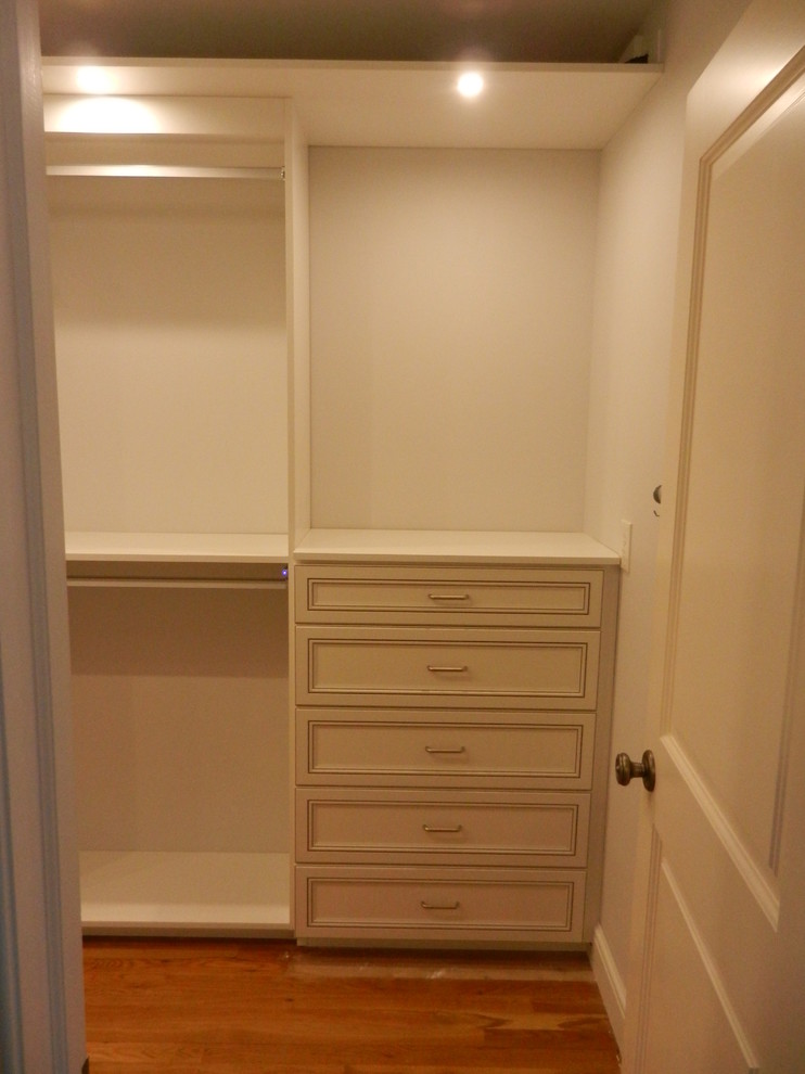 This is an example of a large traditional gender-neutral walk-in wardrobe in Other.