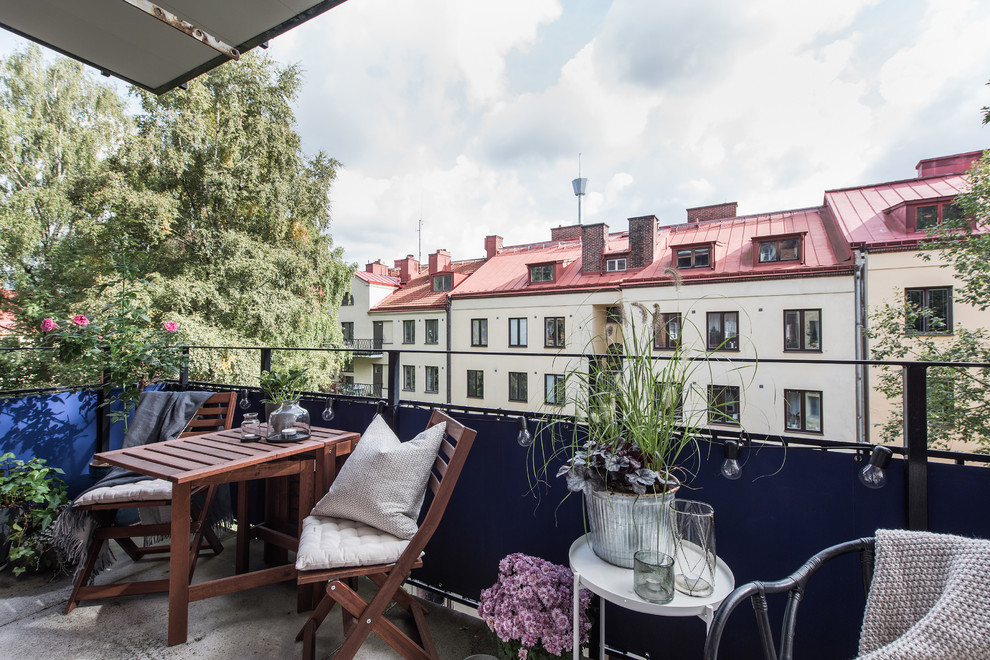 Scandinavian balcony in Gothenburg with an awning and metal railing for for apartments.