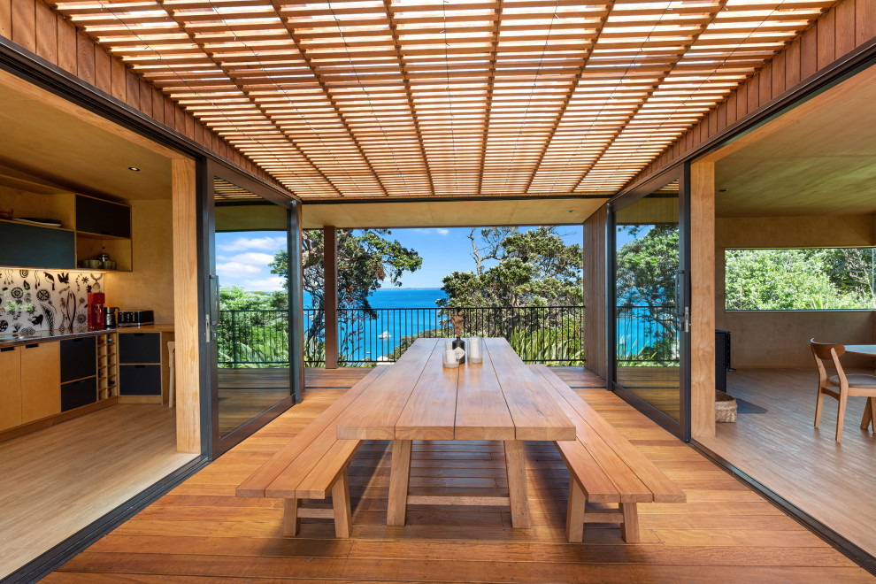 Inspiration for a Mid-sized tropical dining room With Medium Hardwood Floors.