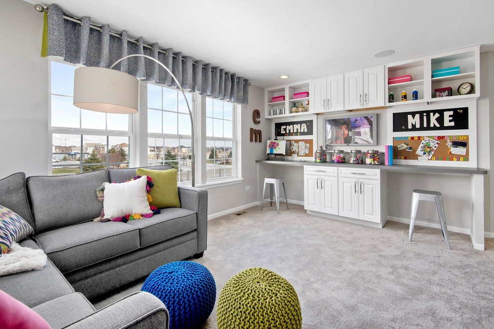 Mid-sized contemporary gender-neutral kids' room in Chicago with white walls and carpet.