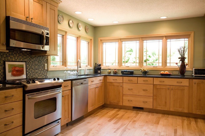 Kitchen - transitional l-shaped light wood floor kitchen idea in Providence with an undermount sink, shaker cabinets, light wood cabinets, multicolored backsplash, mosaic tile backsplash and stainless steel appliances