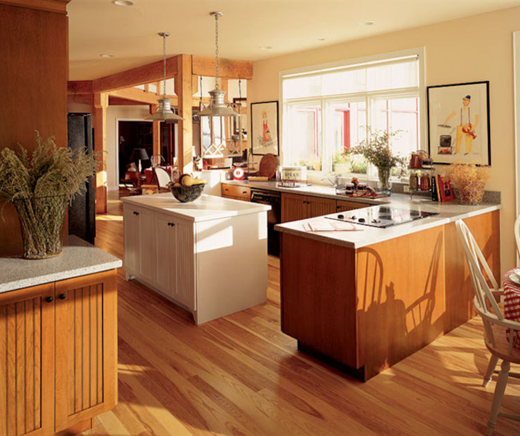 Example of a mid-sized transitional u-shaped brown floor and dark wood floor enclosed kitchen design in Orange County with an undermount sink, louvered cabinets, dark wood cabinets, granite countertops, beige backsplash, stone tile backsplash, stainless steel appliances and an island