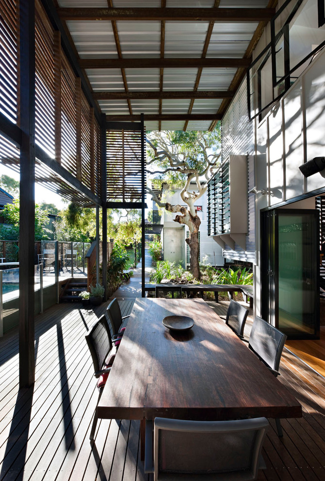 Design ideas for a tropical deck in Sunshine Coast.