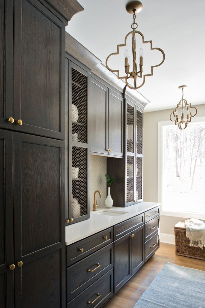Mid-sized transitional single-wall light wood floor and beige floor kitchen pantry photo in Minneapolis with gray cabinets, quartz countertops, white backsplash, recessed-panel cabinets, an undermount sink, ceramic backsplash and no island
