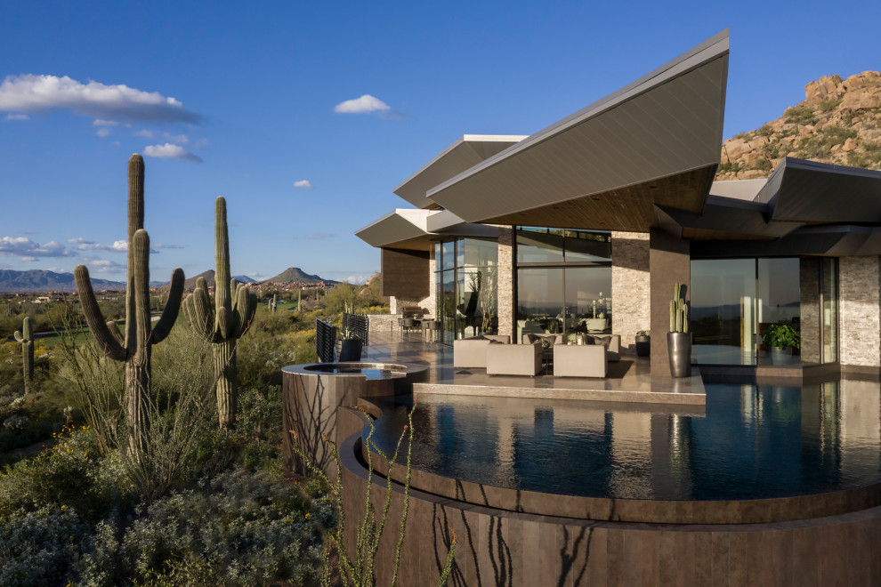 Example of a large minimalist custom-shaped infinity hot tub design in Phoenix
