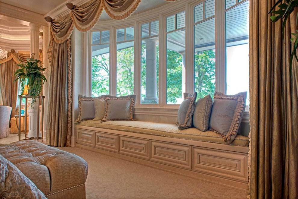 This is an example of a large traditional master bedroom in Charlotte.