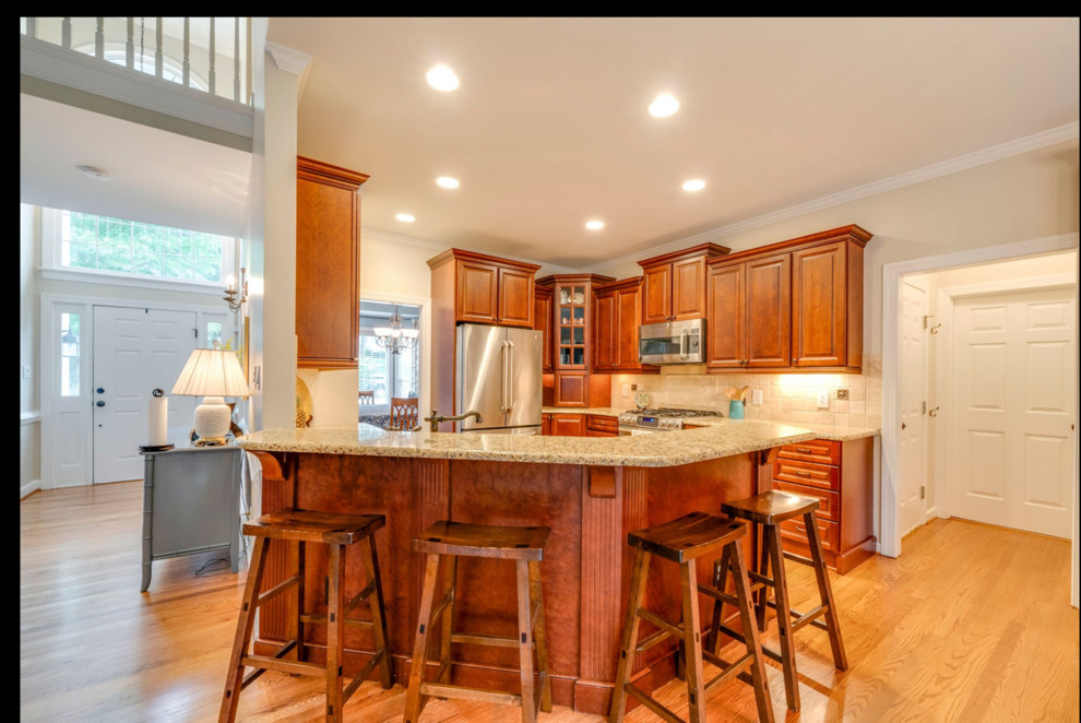 Remodeling 90s kitchen with angled peninsula